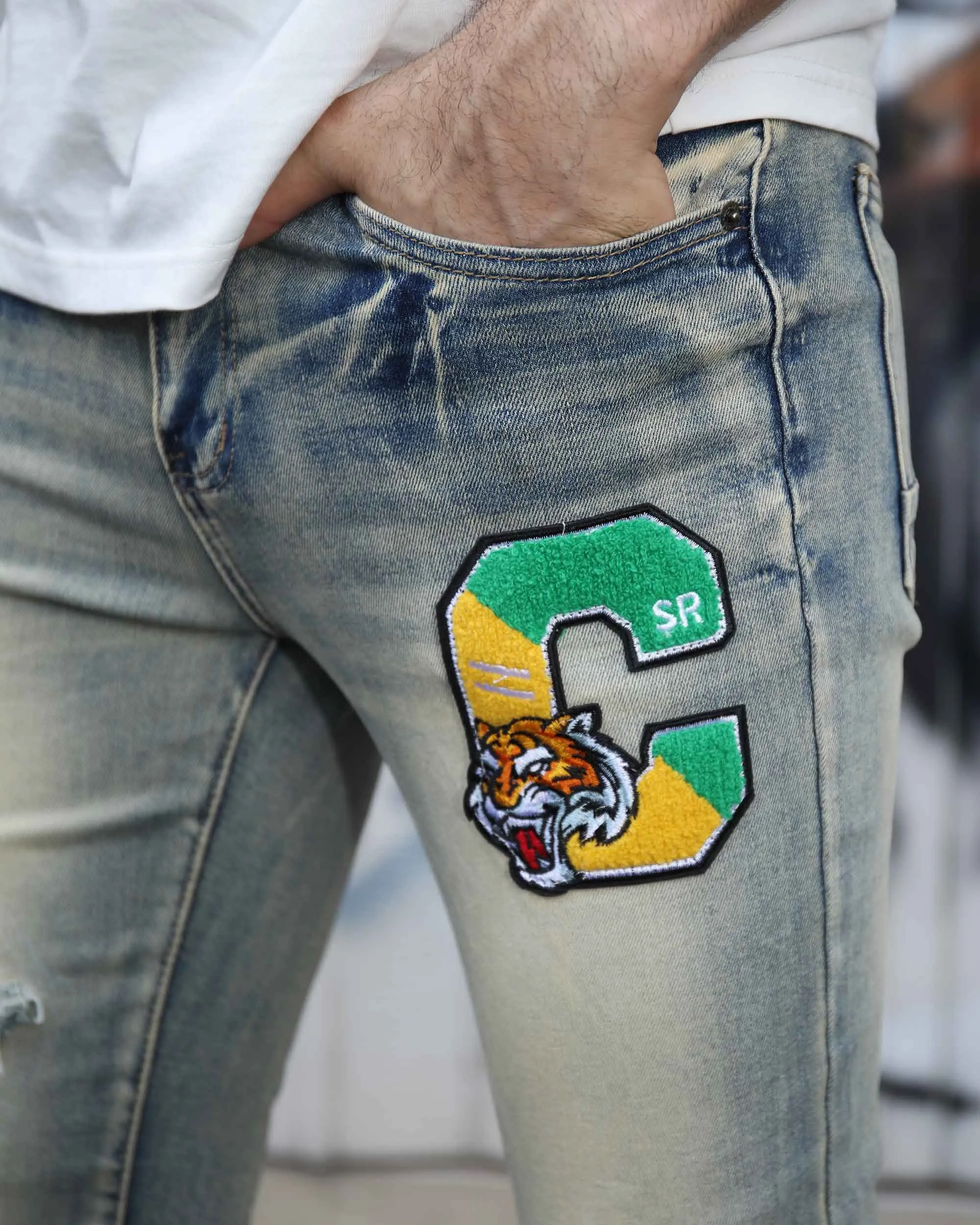 Distressed Light Wash Blue Ripped Jeans with Lion Motif Embroider