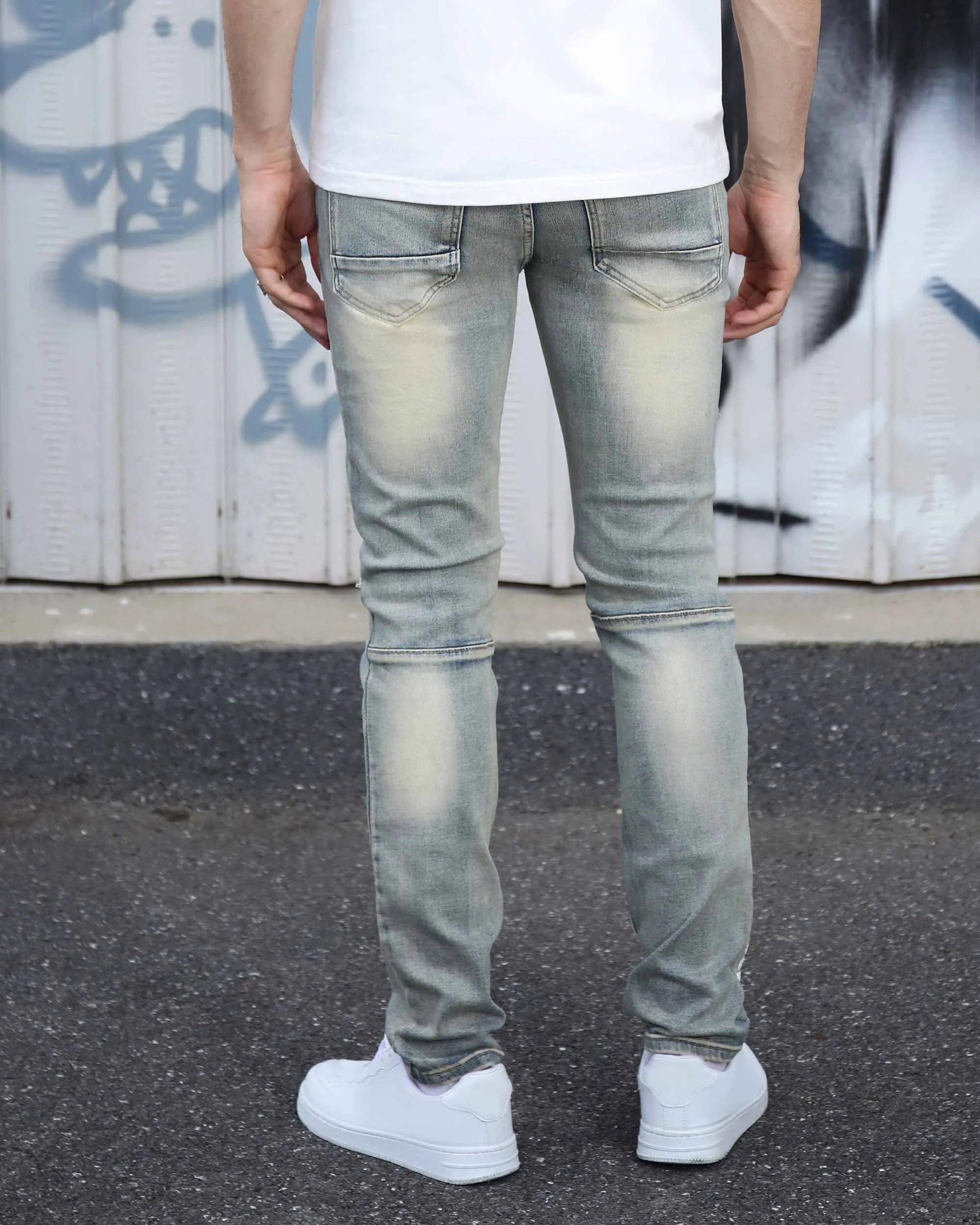 Distressed Light Wash Blue Ripped Jeans with Lion Motif Embroider