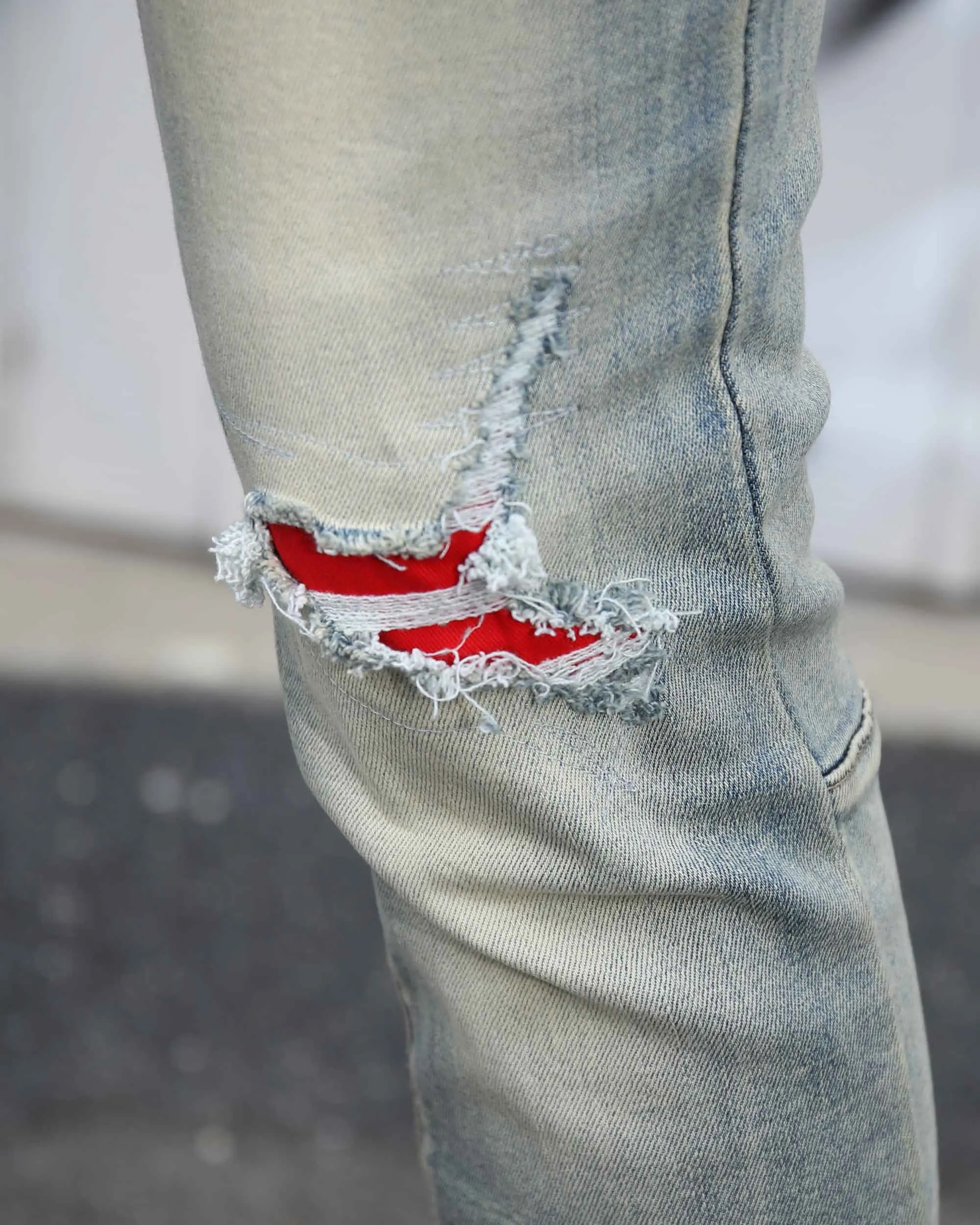 Distressed Light Wash Blue Ripped Jeans with Lion Motif Embroider